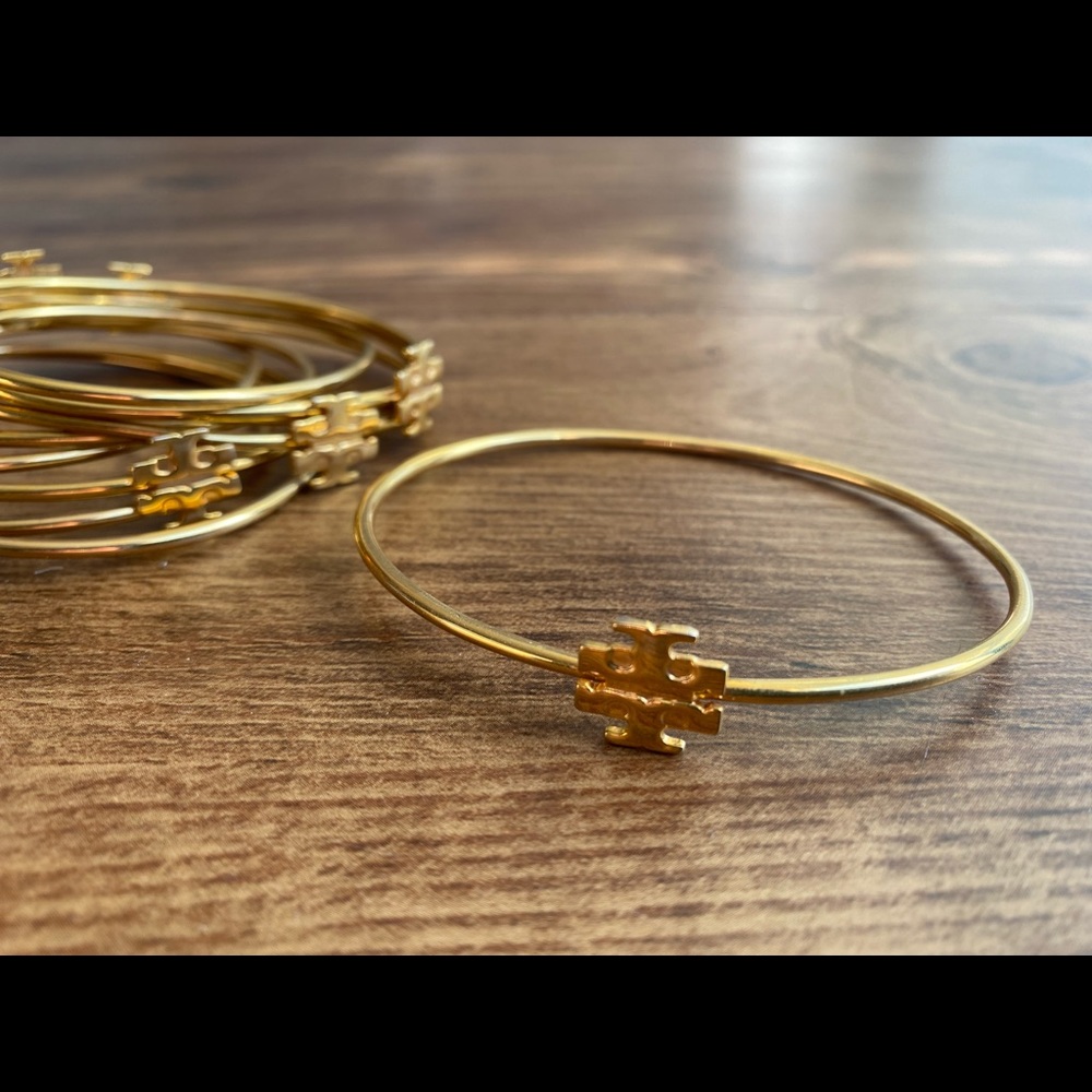 Set of gold logo Tory Burch bangles